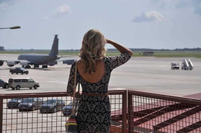 woman watching an airplane