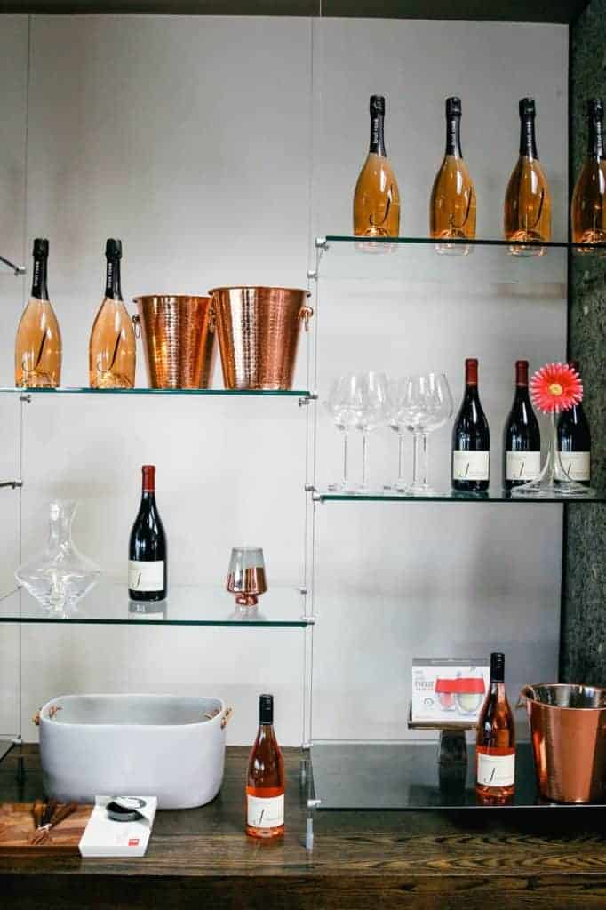 bottles of wine line the shelf at j vineyards in Russian river valley