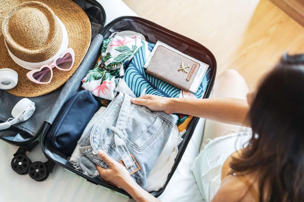 woman packing a suitcase