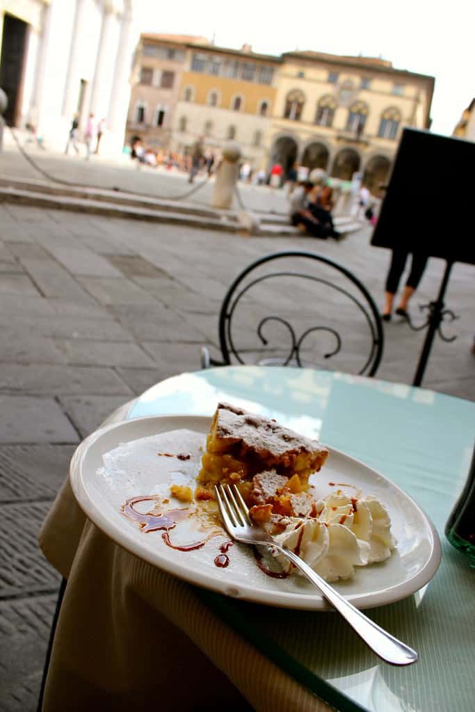 slice of apple pie at a cafe table in lucca italy