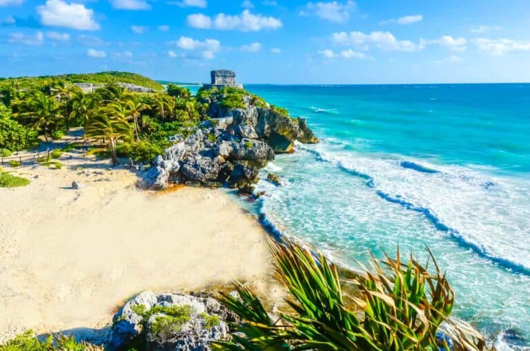 Mayan ruins of Tulum at tropical coast. God of Winds Temple at paradise beach. Mayan ruins of Tulum, Quintana Roo, Mexico.