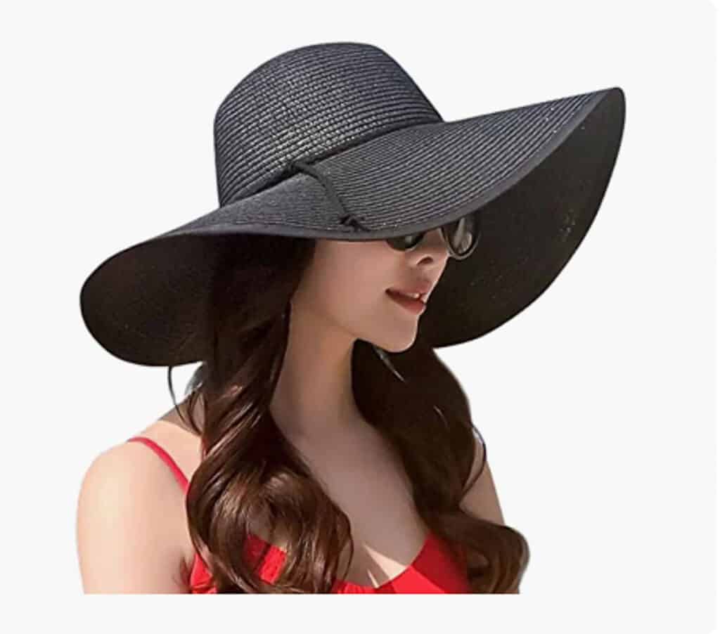 woman wearing a black sun hat