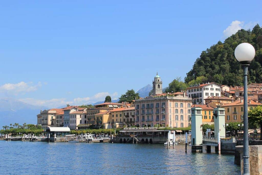 Yellow and orange buildings along the shoreline of Bellagio Italy