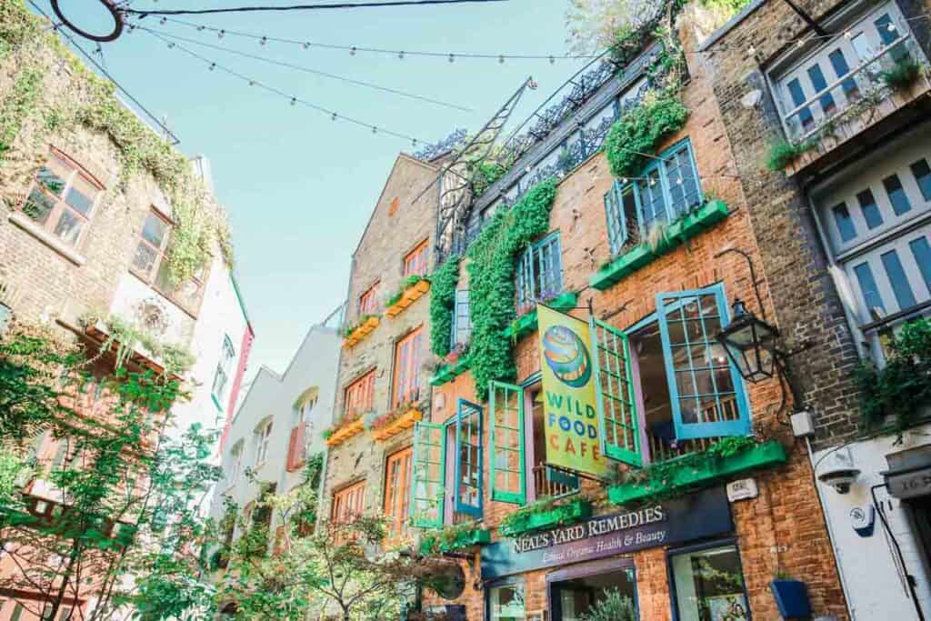 brightly colored buildings in a small courtyard in central London