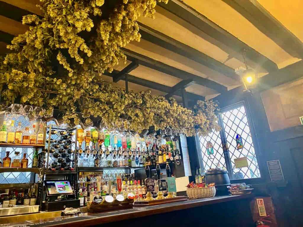 bottles line a bar in a 600 year old hotel