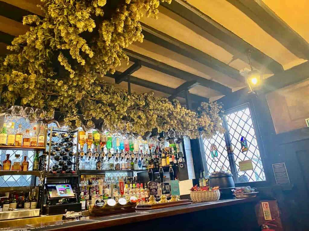 bottles line a bar in a 600 year old hotel