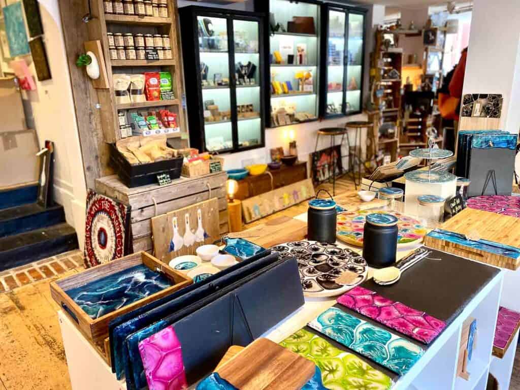 colorful gifts and souvenirs on a shop table