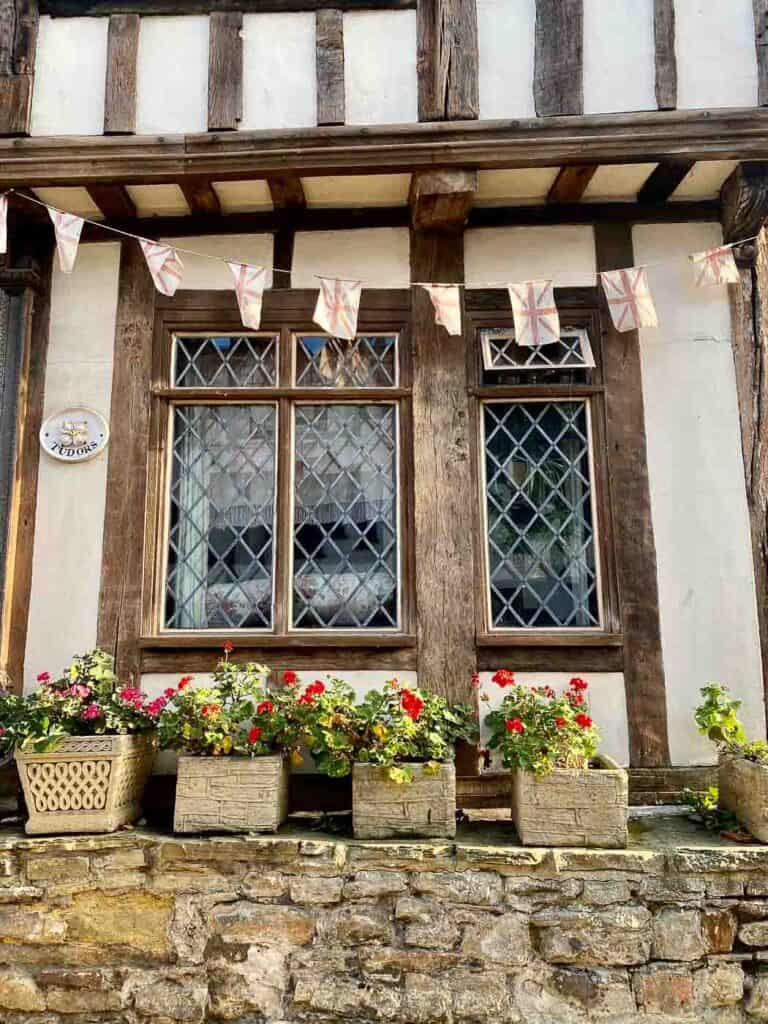 diagonal muntins on the glass window of a tudor style building