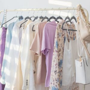 capsule wardrobe hanging on a clothes rack