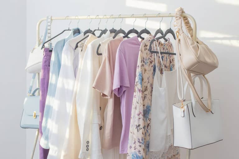 capsule wardrobe hanging on a clothes rack