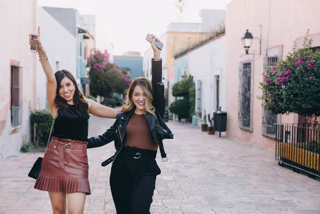 two women mixing and matching clothing pieces while traveling in Mexico